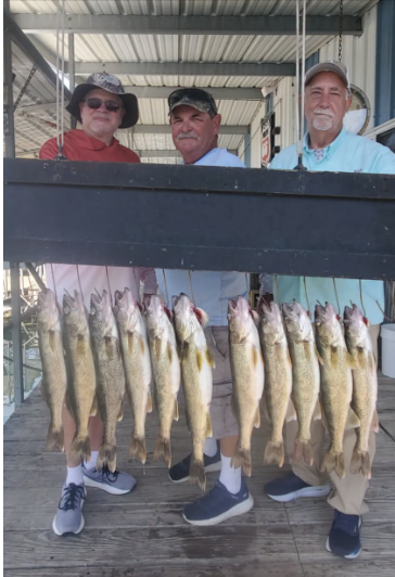 Angler holding a largemouth bass caught on Bull Shoals Lake